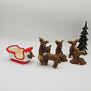 Charming, handcrafted sleigh with six adorable reindeer figurines!
